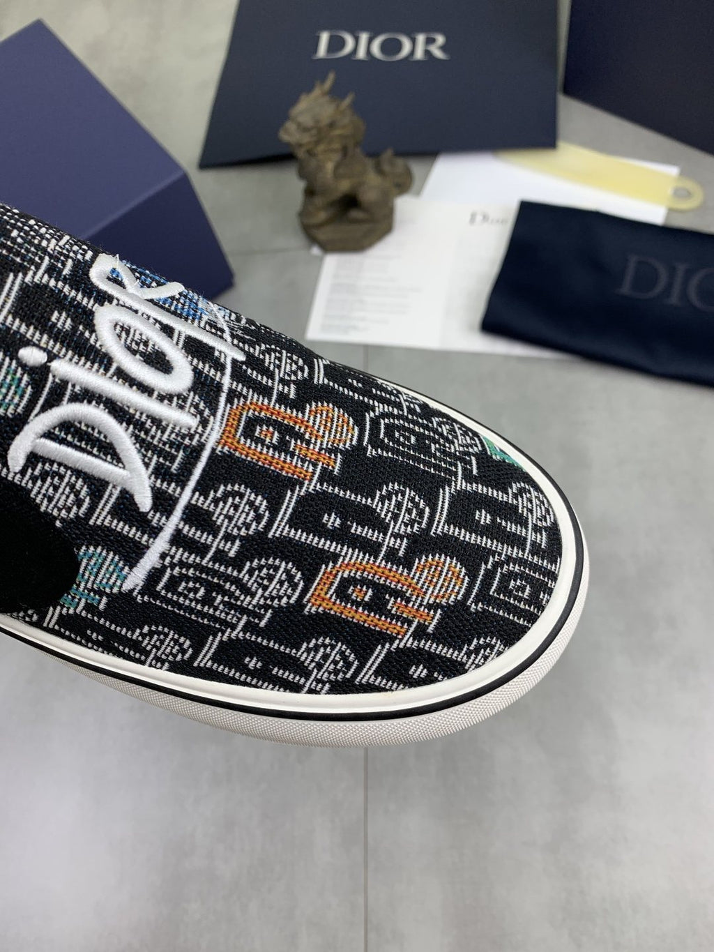 Dior Graphic Canvas Slip-On Sneakers - Black, White and Tan
